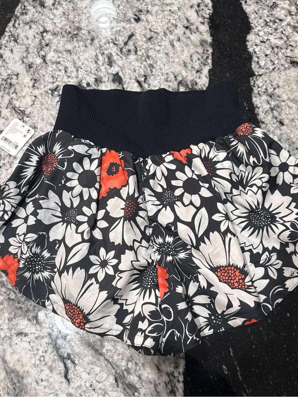 FP Movement by Free People Black Floral Shorts with Orange Accents